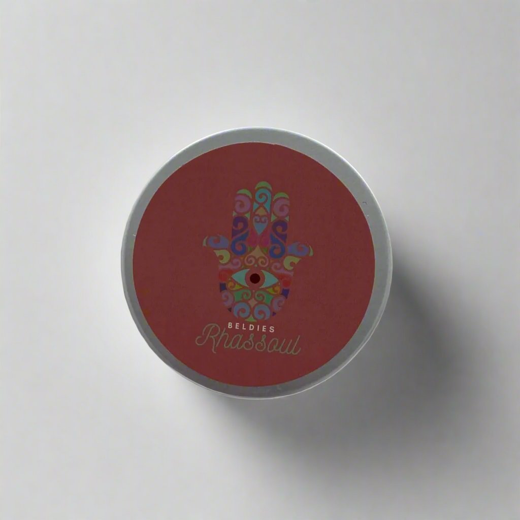 Beldies Rhassoul clay jar, sealed and ready for use, known for its detoxifying and rejuvenating properties for both face and body.