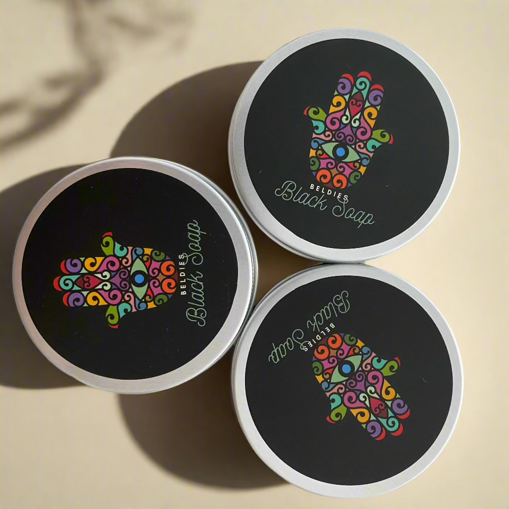 Jar of authentic beldi black soap with a smooth, dark texture, made from natural olive paste, perfect for gentle exfoliation and deep cleansing as part of a traditional Moroccan hammam ritual.