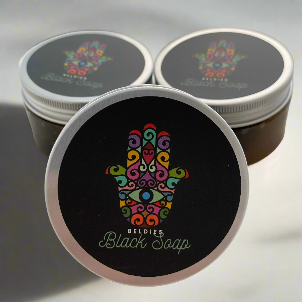 Jar of authentic beldi black soap with a smooth, dark texture, made from natural olive paste, perfect for gentle exfoliation and deep cleansing as part of a traditional Moroccan hammam ritual.
