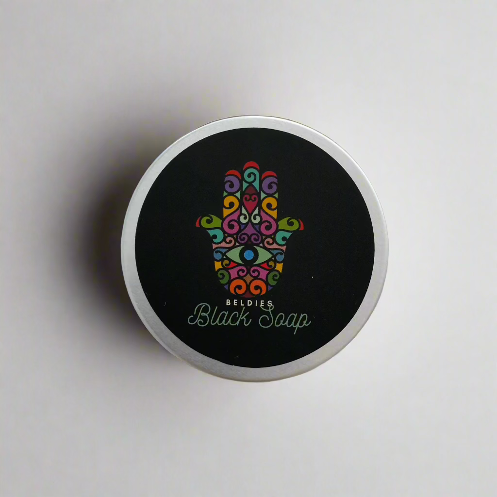 Jar of authentic beldi black soap with a smooth, dark texture, made from natural olive paste, perfect for gentle exfoliation and deep cleansing as part of a traditional Moroccan hammam ritual.