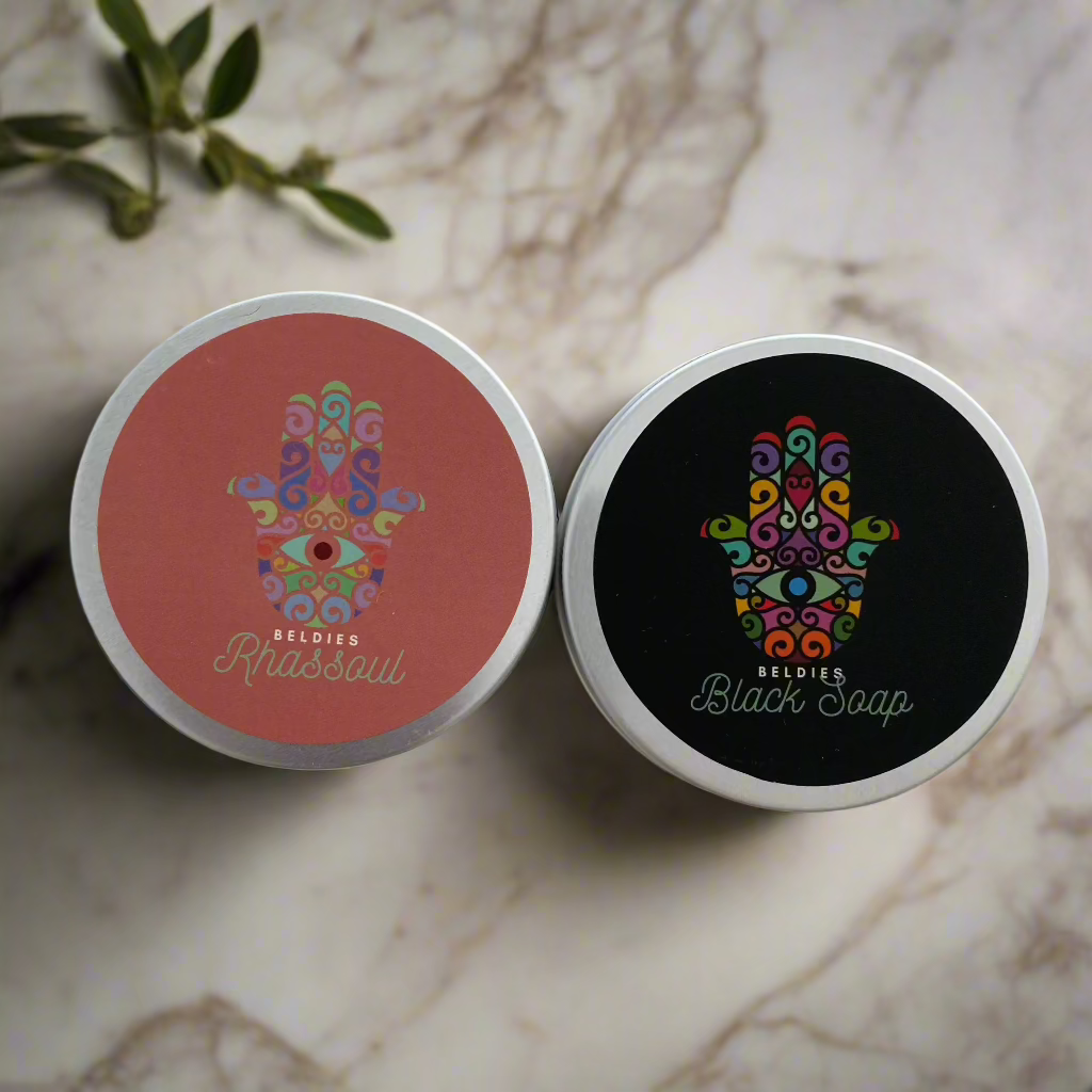 Beldies Rhassoul and Moroccan Black Soap Set, featuring the jars of Rhassoul clay and Moroccan Black Soap.