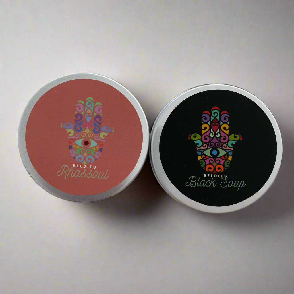 Beldies Rhassoul and Moroccan Black Soap Set, featuring the jars of Rhassoul clay and Moroccan Black Soap.