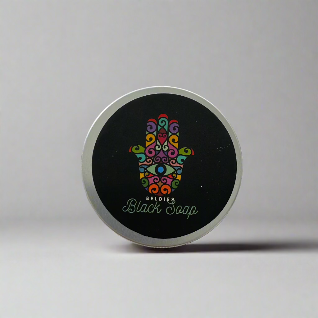 Jar of authentic beldi black soap with a smooth, dark texture, made from natural olive paste, perfect for gentle exfoliation and deep cleansing as part of a traditional Moroccan hammam ritual.